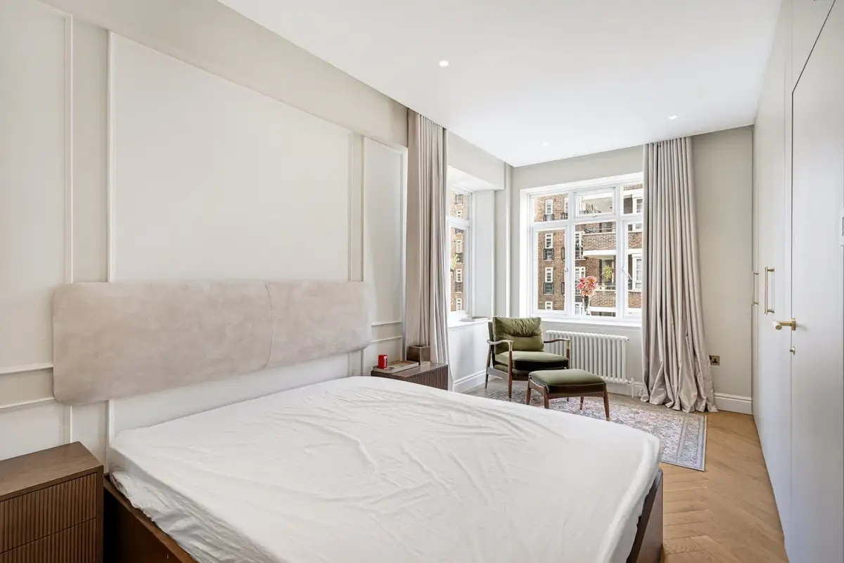 The same bedroom virtually dressed with bedding, cushions and an armchair, Marsham Court