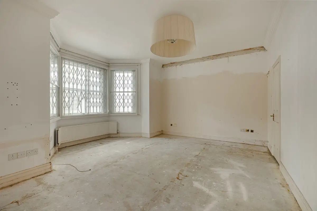 Bedroom at Onslow Gardens, shown as an empty room with a bare floor and then virtually renovated